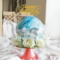 Blue Chocolate Pinata Ball Cake from LallanTop Cake Shop